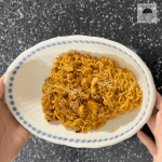 The finished product of this super easy recipe: a white bowl with a bowl of rabbit stew.