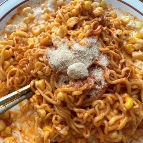 Stir-fried bulgogi noodles with corn cheese sauce and added sugar