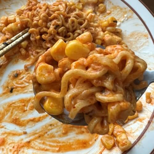 What corn cheese bulgogi noodles look like on a spoon