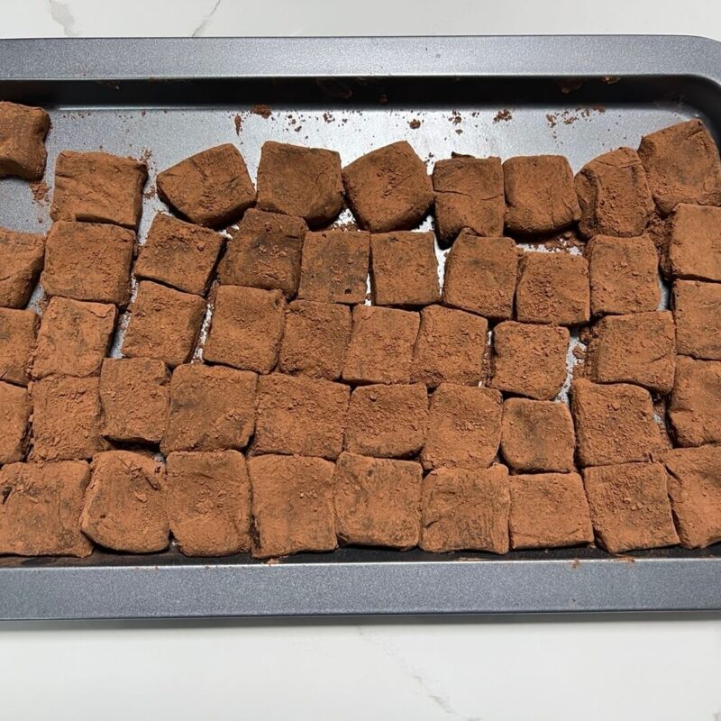 Chocolate covered with cocoa powder up to the cut end.
