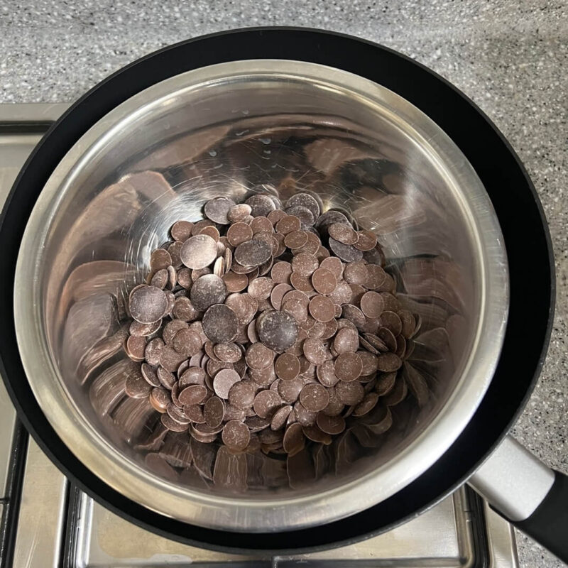 The chocolate is not yet melted, as shown by stirring the chocolate.