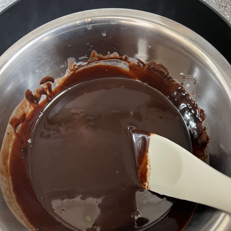 The chocolate is melted smoothly over medium heat