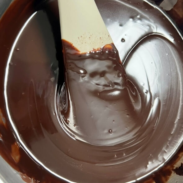 The whipped cream and chocolate are mixed well and have the right consistency.