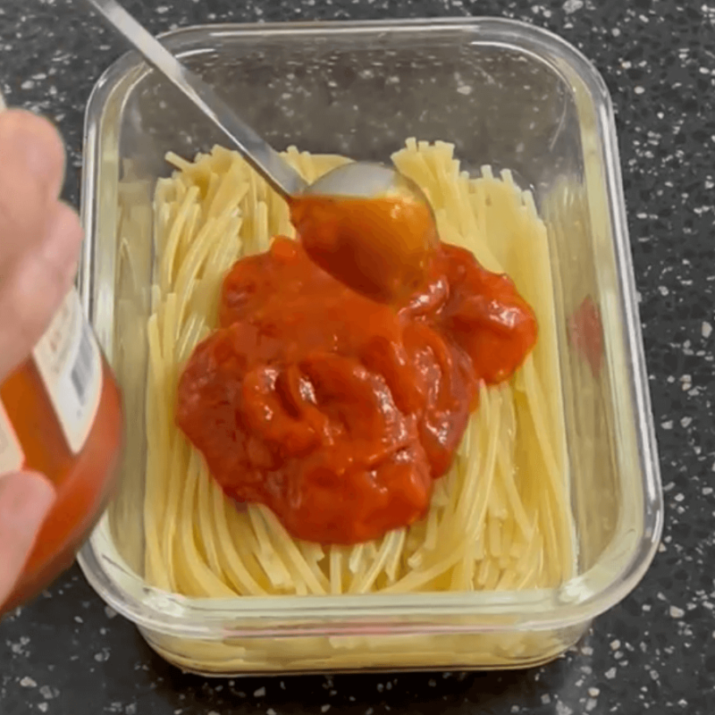 Adding tomato sauce