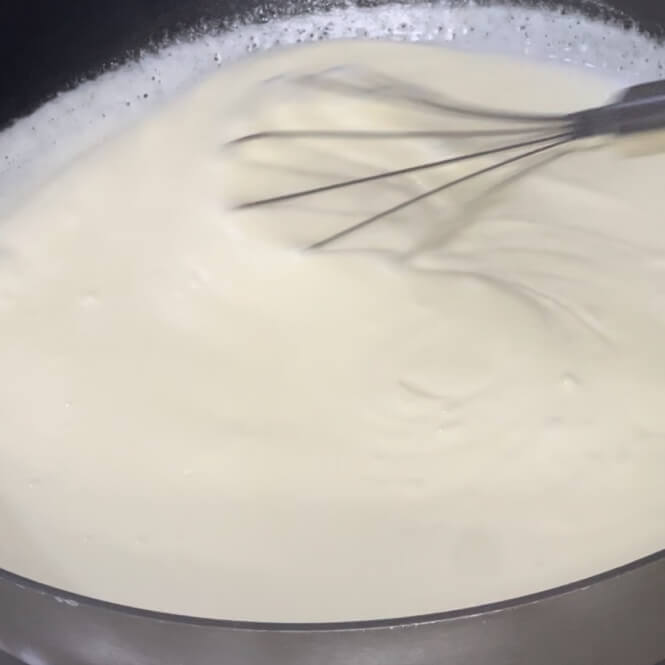 Starting to bring the whipped cream mixture to a boil