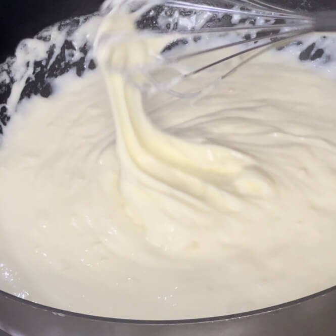What the finished whipped cream mixture should look and feel like when it's boiled