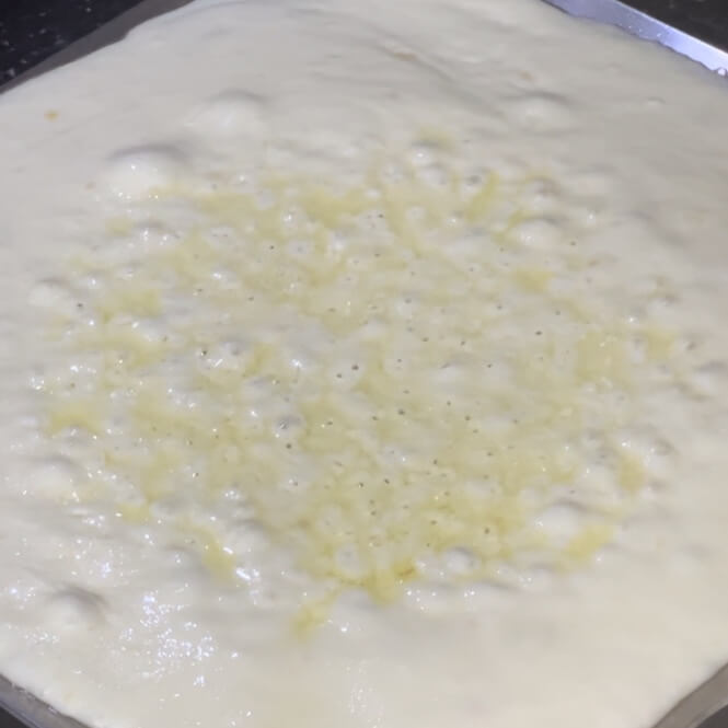 Whipped cream mixture heating in a wide pan