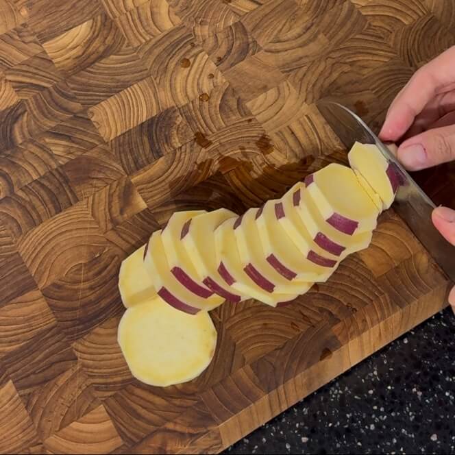 Cutting a sweet potato