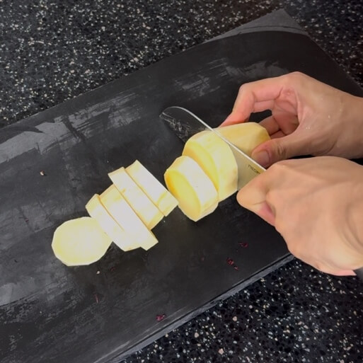 Cutting a sweet potato