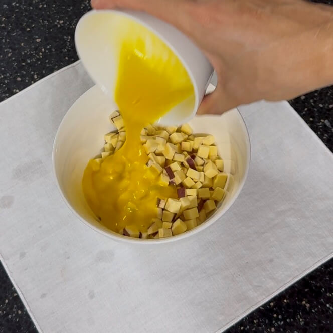 Adding the beaten egg mixture