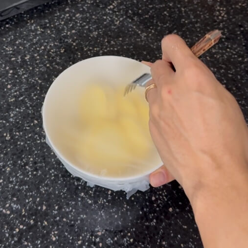 Poking holes in the wrap with a fork