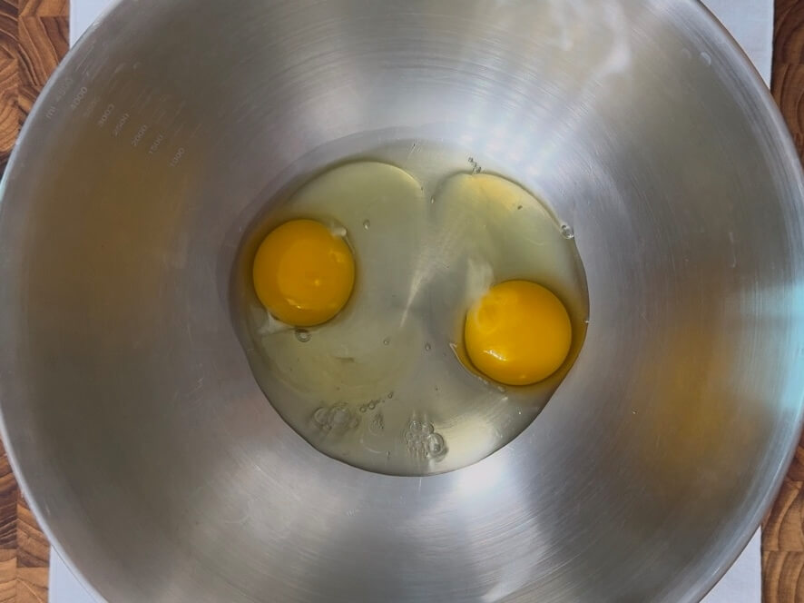 Two eggs cracked open