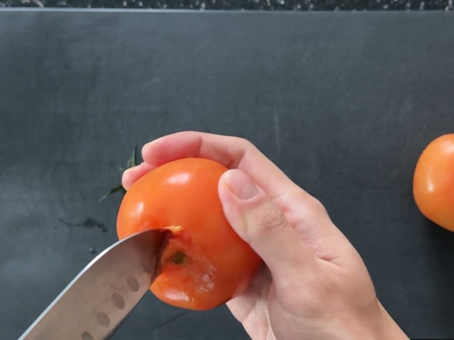 Removing the top of a tomato