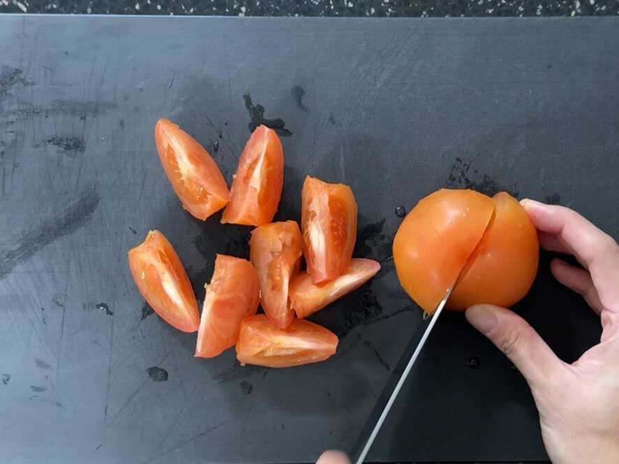 Cutting a tomato into eighths