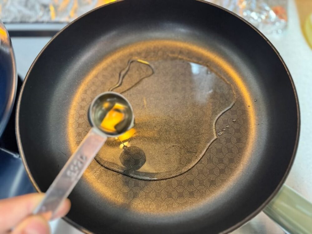 Adding oil to a pan
