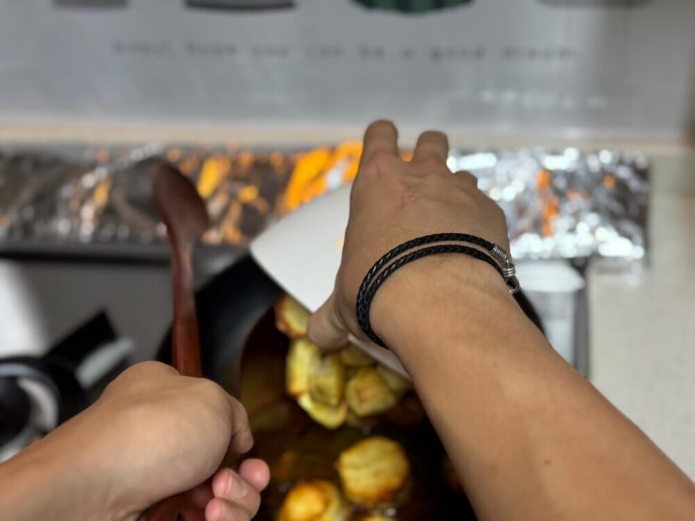 Sweet potato in a pan with sugar syrup