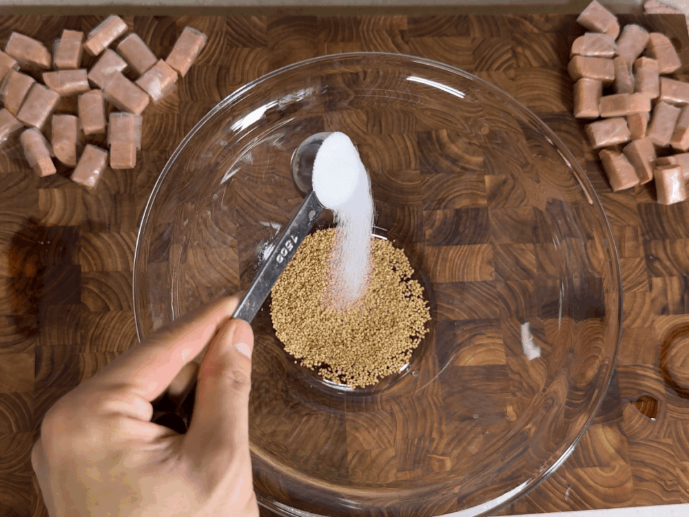 Adding sugar to the bowl