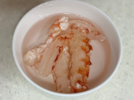 Frozen shrimp submerged in water