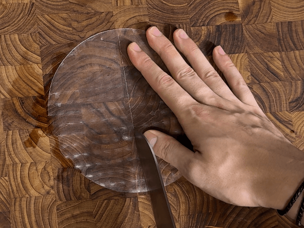Cutting a piece of rice paper in half