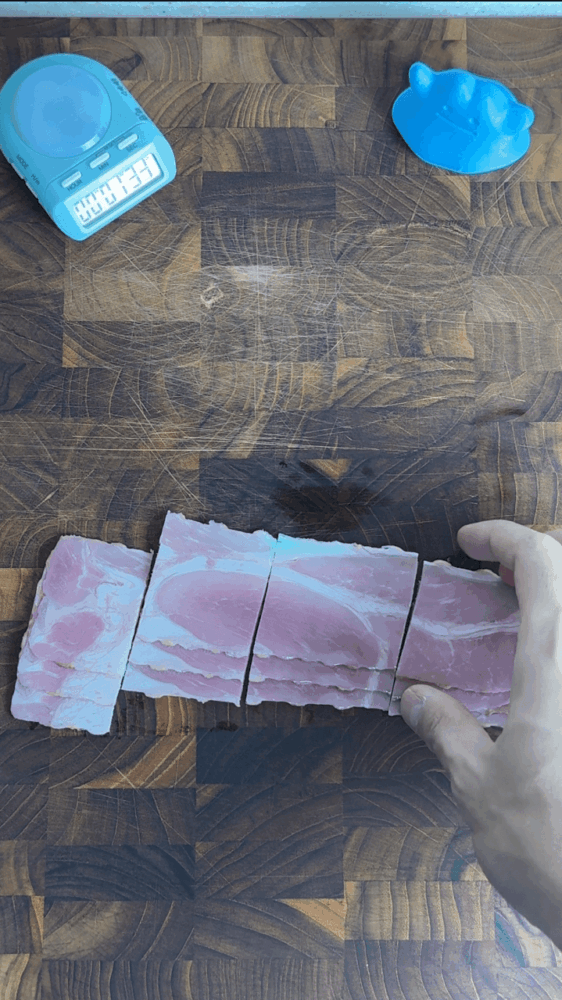 Cutting bacon into bite-sized pieces