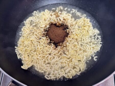 Spaghetti noodles unwrapped and powdered soup added