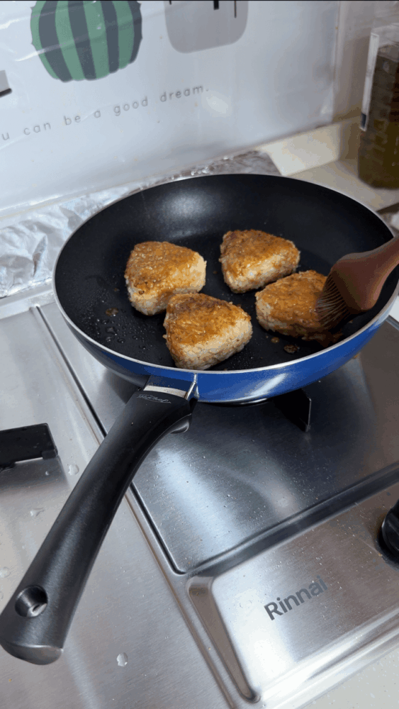Applying miso sauce to rice balls