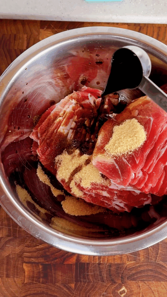 Adding dark soy sauce to the pork forequarters