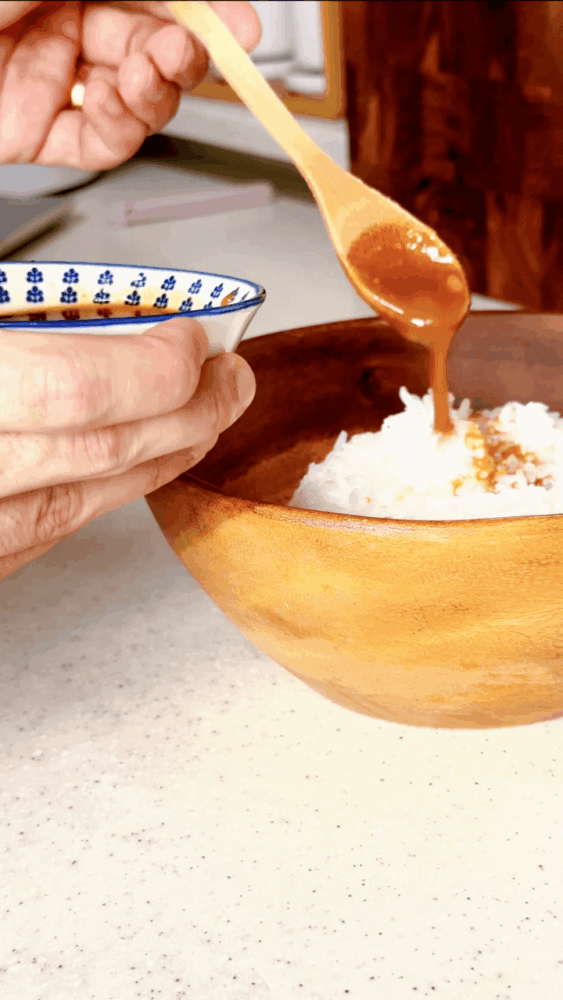Adding miso sauce to rice